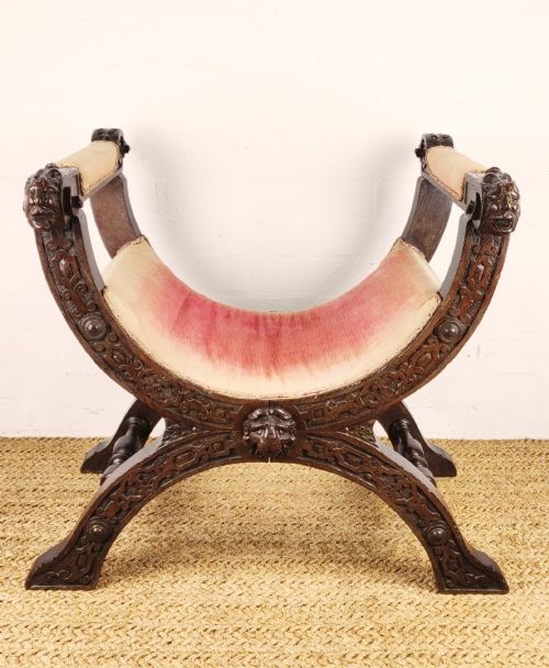 A17th  Century Carved Savonarola Chair.