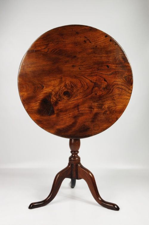 An 18th Century Elm Tripod Table.