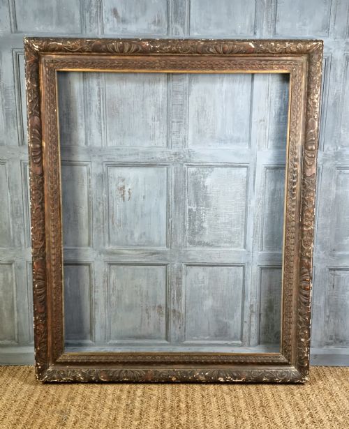 A Large 17thc Style Carved Picture Frame.