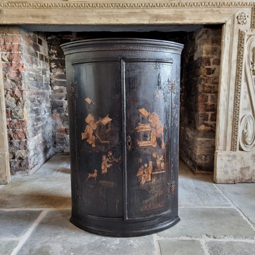 An 18th Century Chinoiserie Corner Cupboard.