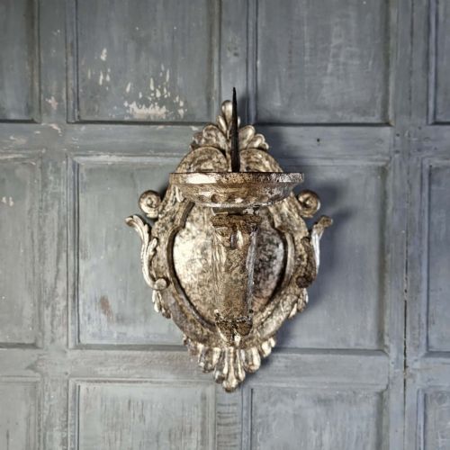 A pair of 17th-century carved wood wall sconces with silvered gilding, featuring ornate cartouche backplates, scrolling arms, and iron prickets. View II
