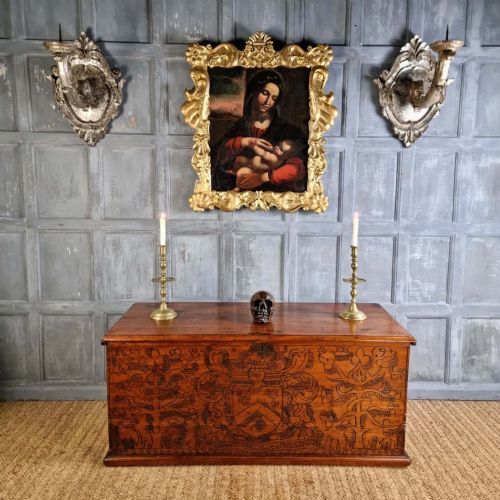 A pair of 17th-century carved wood wall sconces with silvered gilding, featuring ornate cartouche backplates, scrolling arms, and iron prickets. View XIV