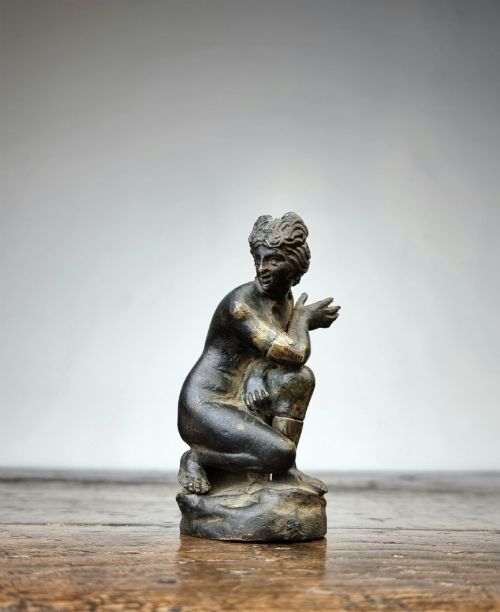 A Small 17th Century Bronze Crouching Venus.