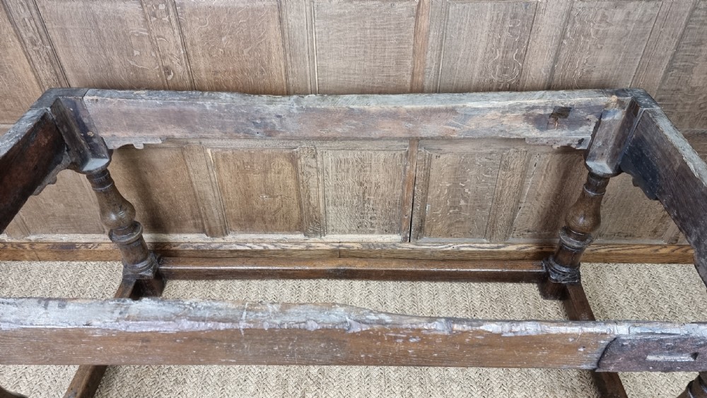 A 17th century oak refectory table. View XVII