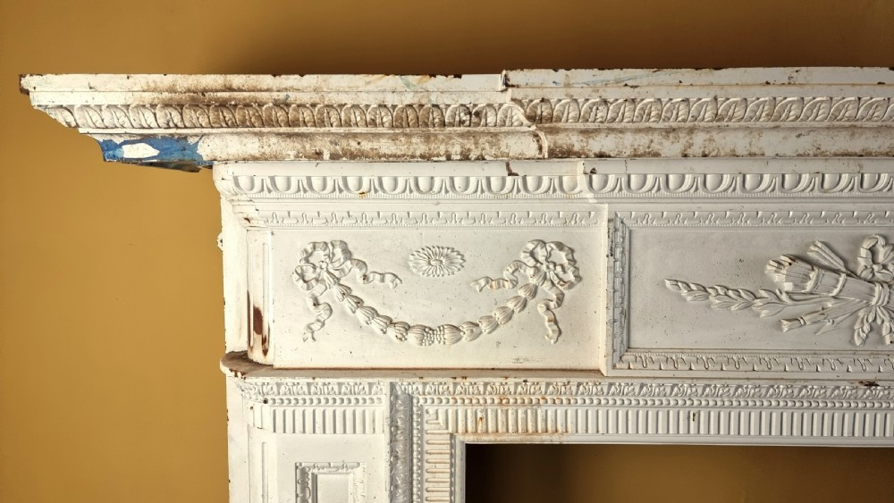 A large 19th century cast iron fire surround. View VII