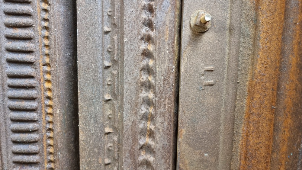 A large 19th century cast iron fire surround. View XXII