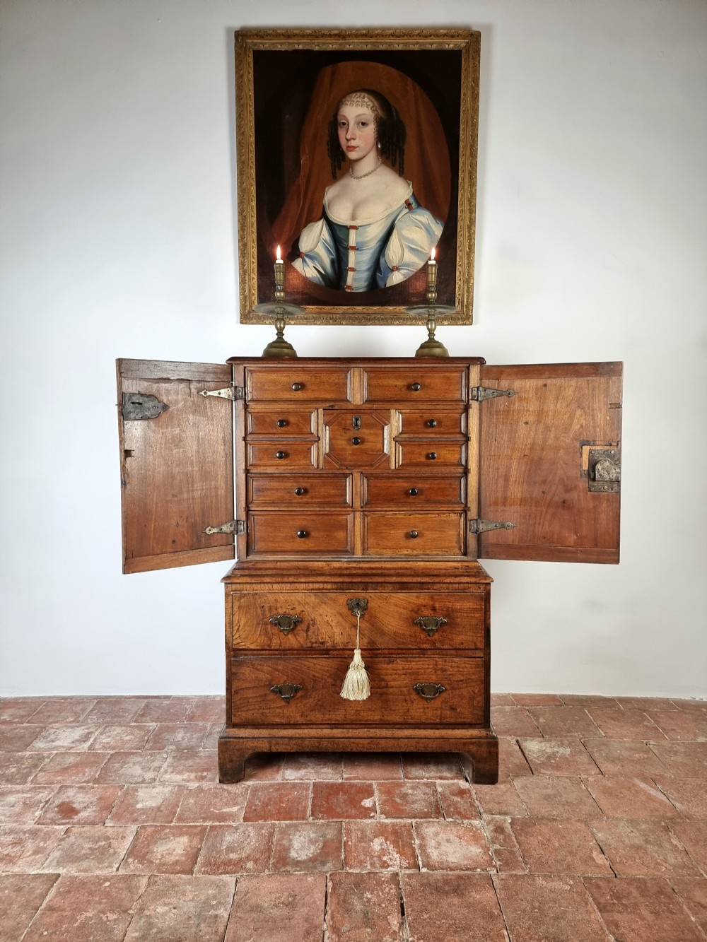 A small 18th century enclosed cabinet on chest. 