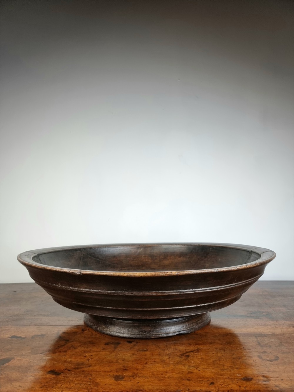 An enormous 18thC turned footed bowl. 