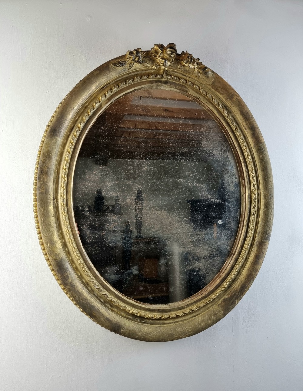 19th century oval mirror. 