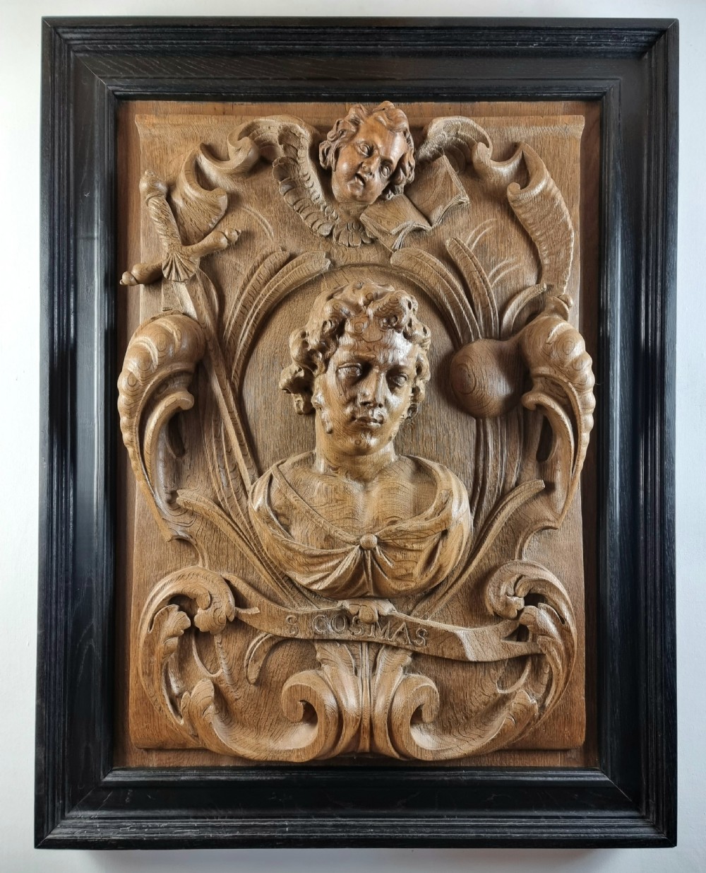A large 17th century panel of St Cosmos. 