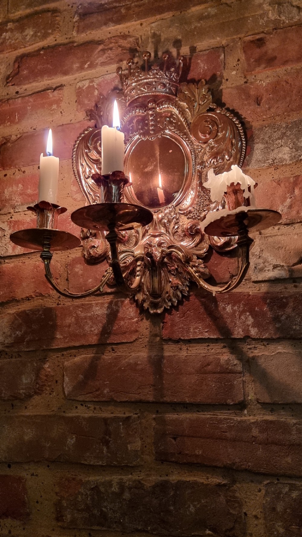 A pair of 19th century repousse wall sconces.  View II
