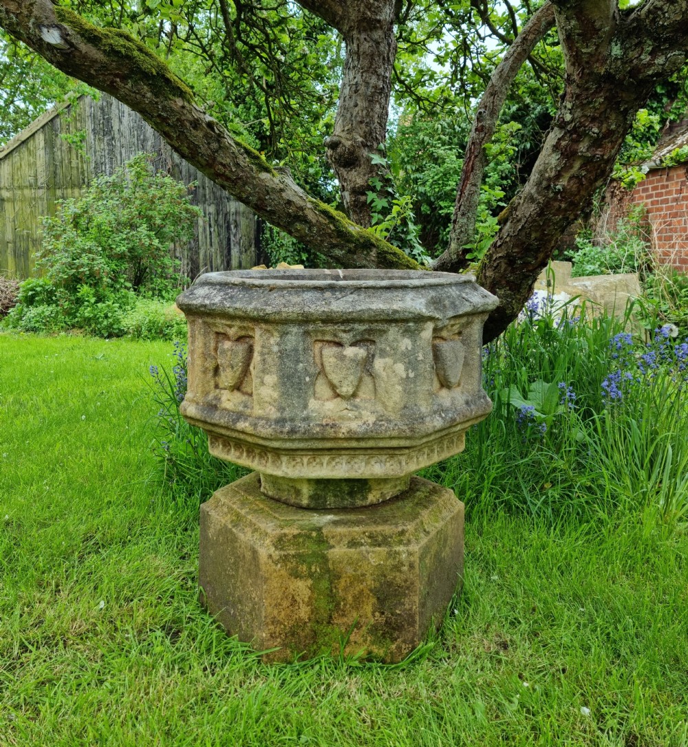A 16th century gothic limestone font. 