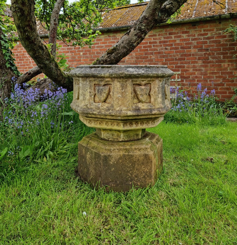 A 16th century gothic limestone font.  View II