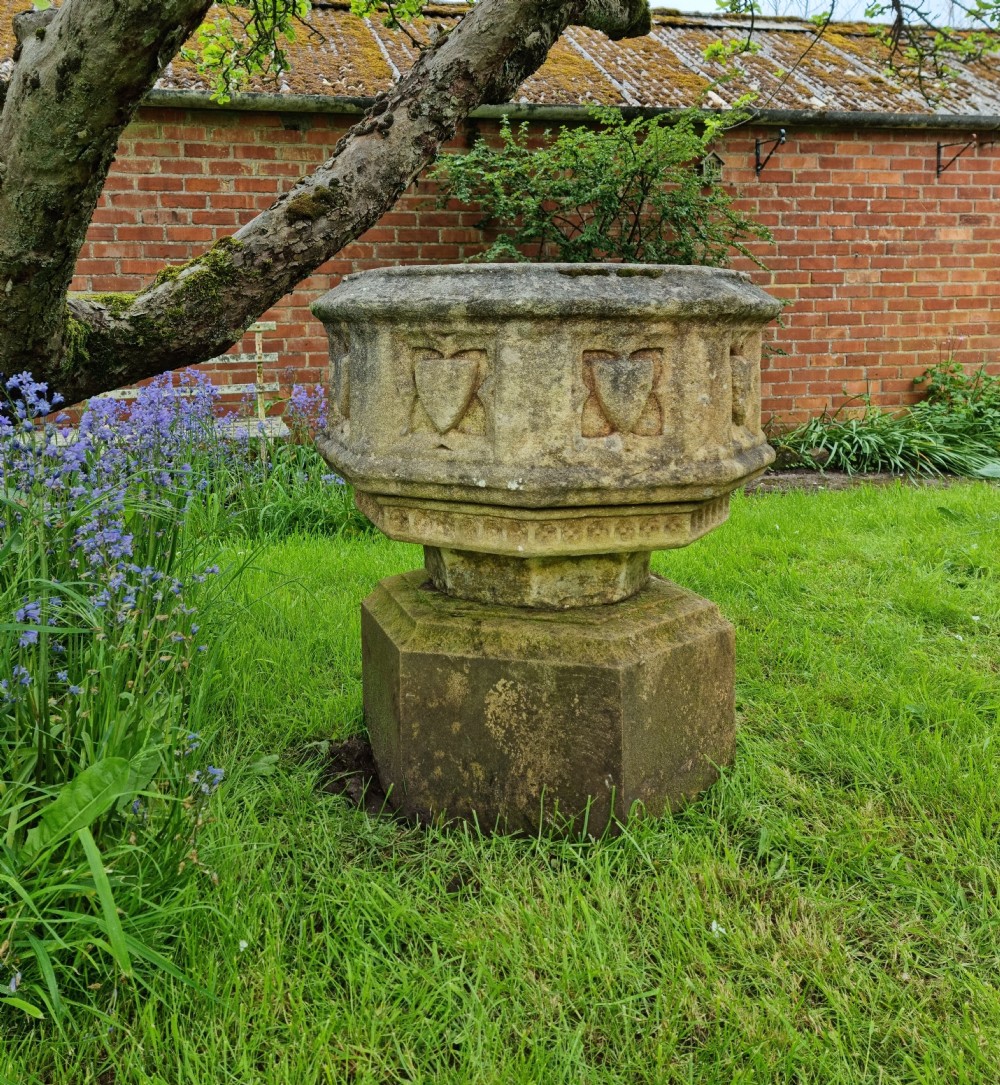 A 16th century gothic limestone font.  View III