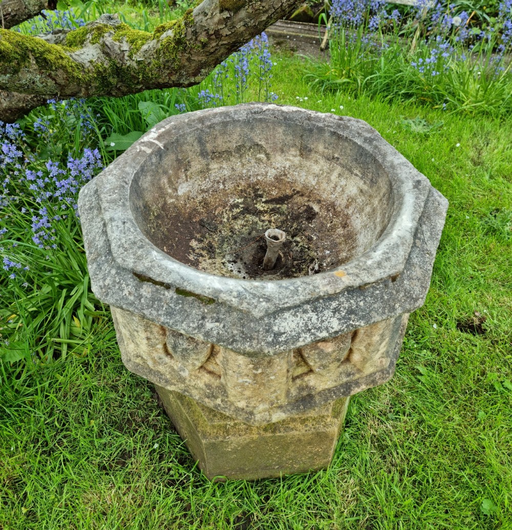 A 16th century gothic limestone font.  View IV