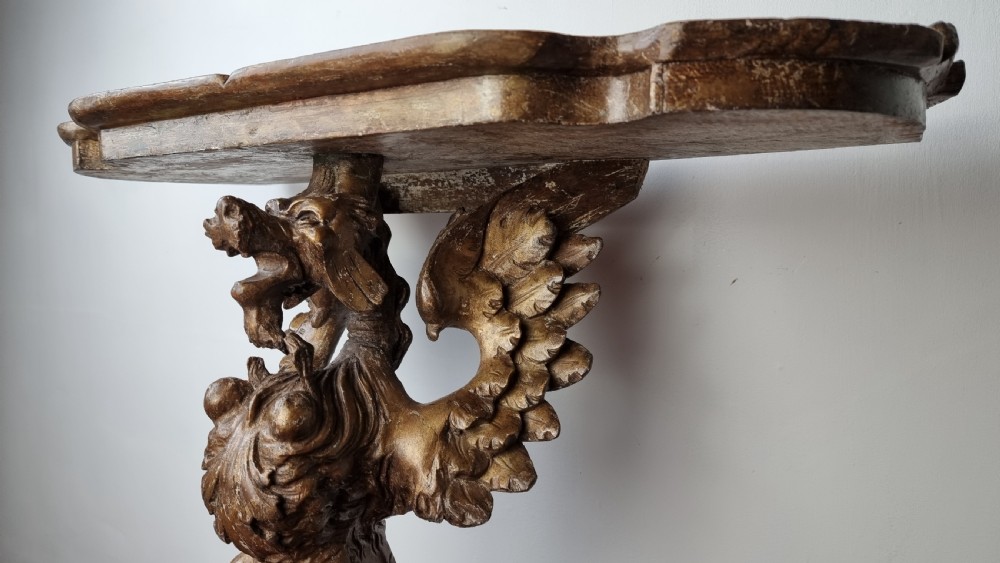A 19th century gilt carved console table.  View II