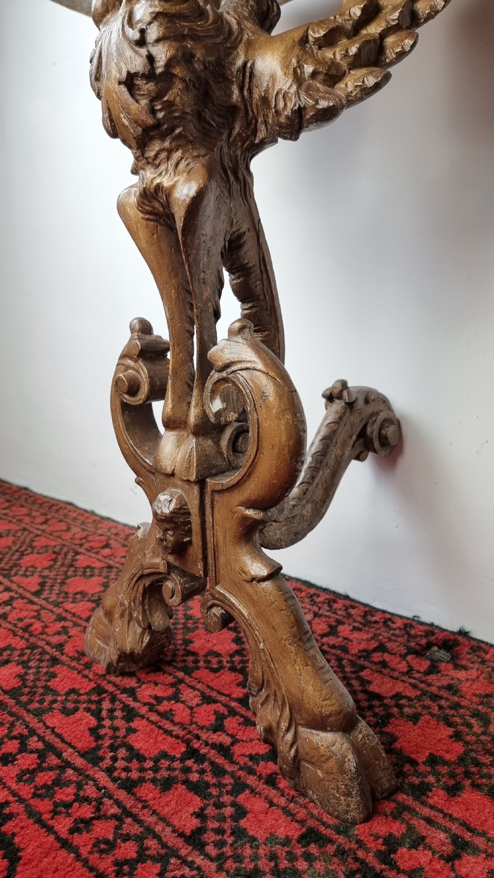 A 19th century gilt carved console table.  View III