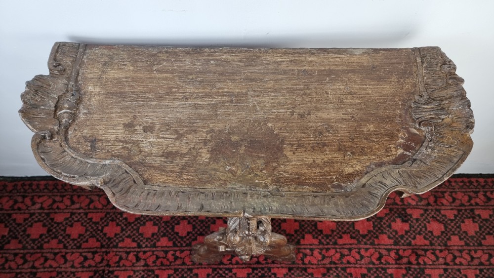 A 19th century gilt carved console table.  View IV
