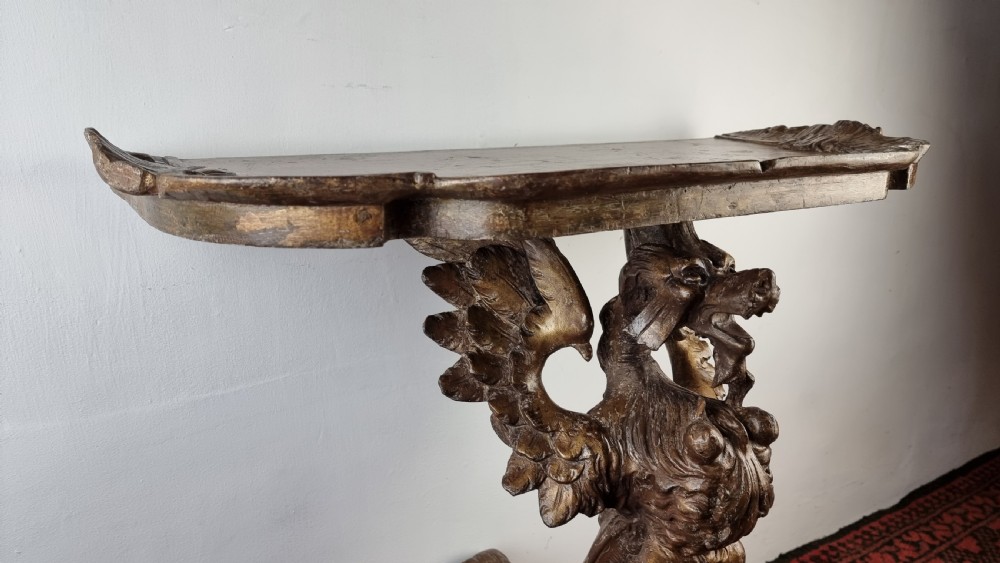 A 19th century gilt carved console table.  View IX