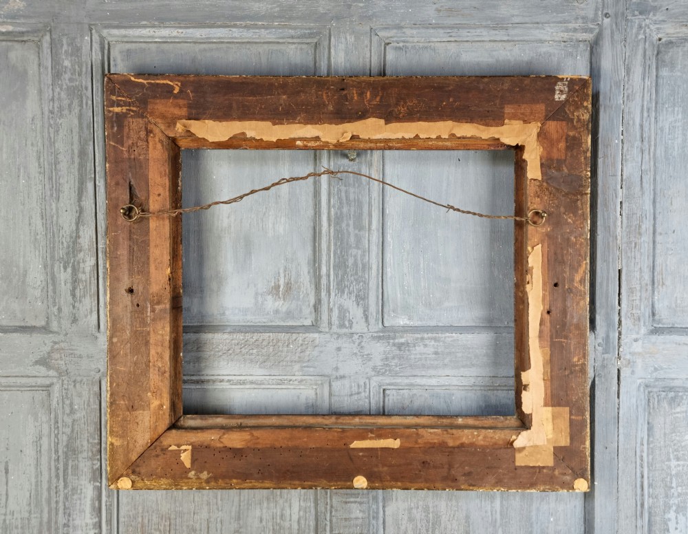 A small 18th century gilt carved picture frame.  View V