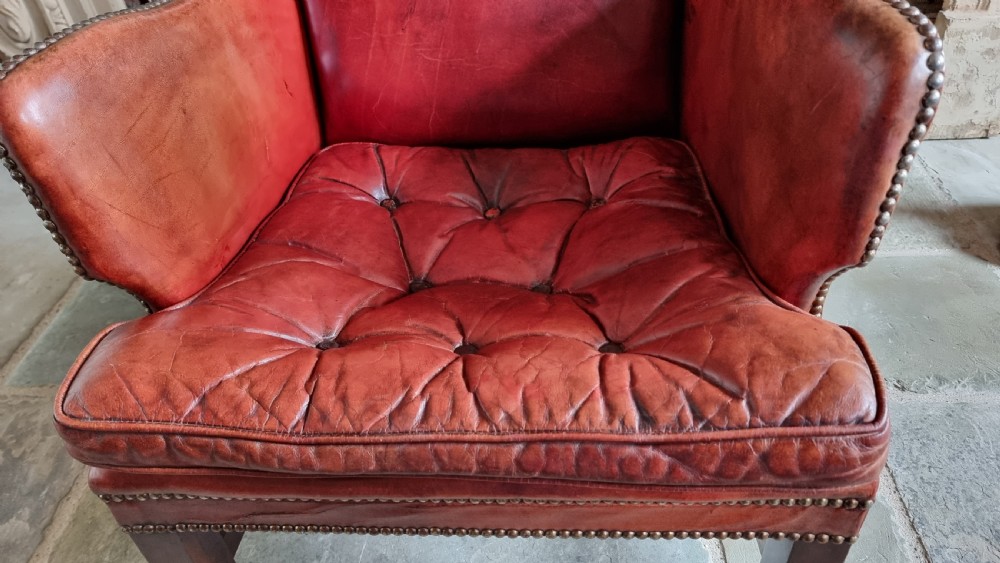 A small Georgian style leather wingchair.  View VII