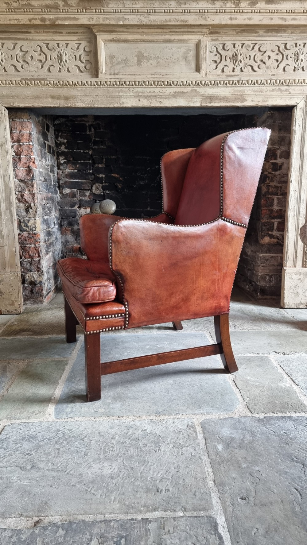 A small Georgian style leather wingchair.  View VIII