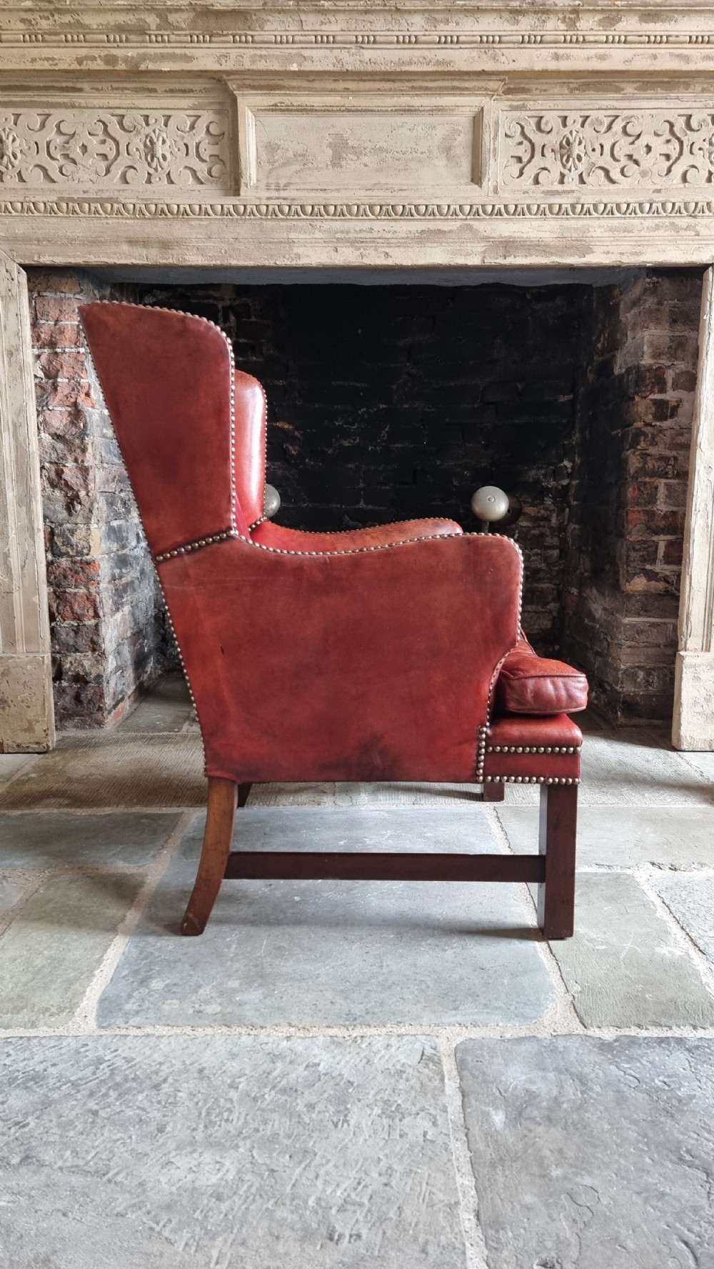 A small Georgian style leather wingchair.  View IX