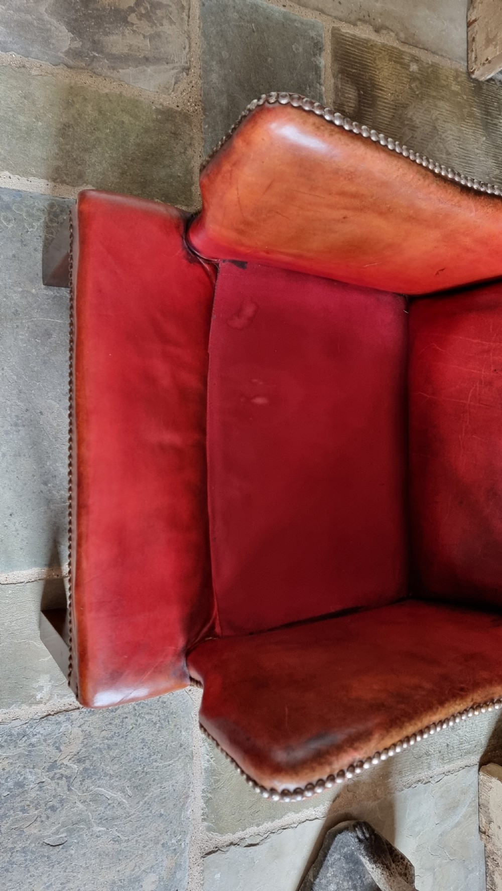A small Georgian style leather wingchair.  View XII