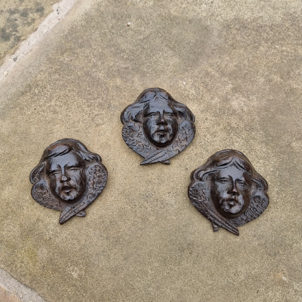 Three 17th century winged heads.