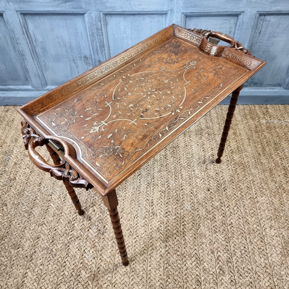 A 19thC padouk folding campaign table. View VI