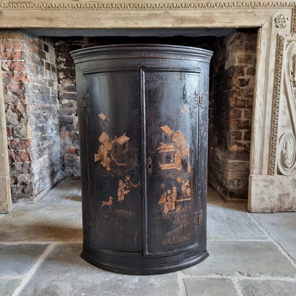 An 18th century chinoiserie corner cupboard. 