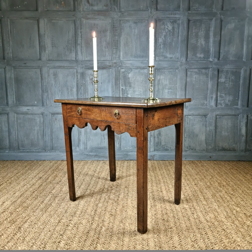 An 18th century oak side table.