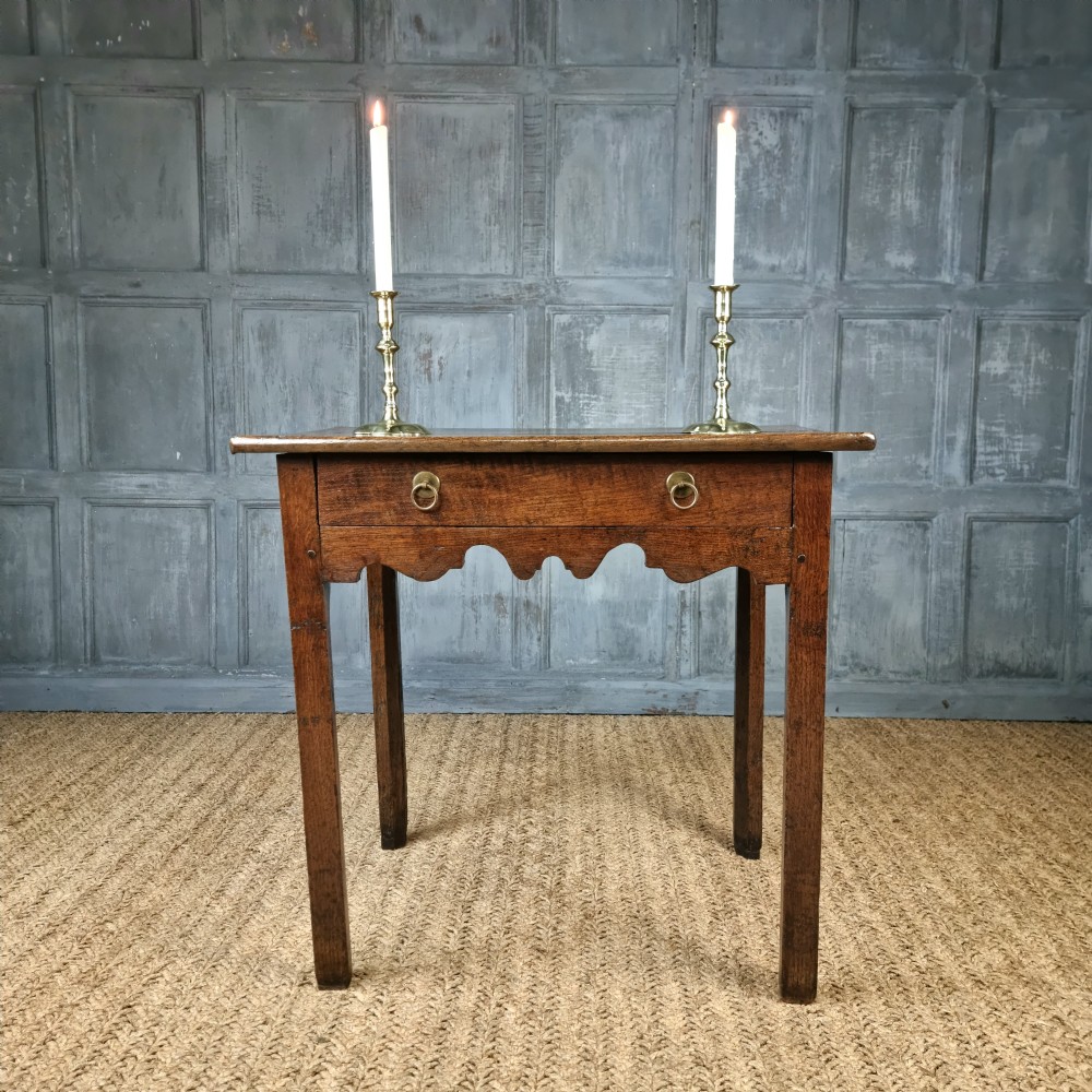 An 18th century oak side table. View II