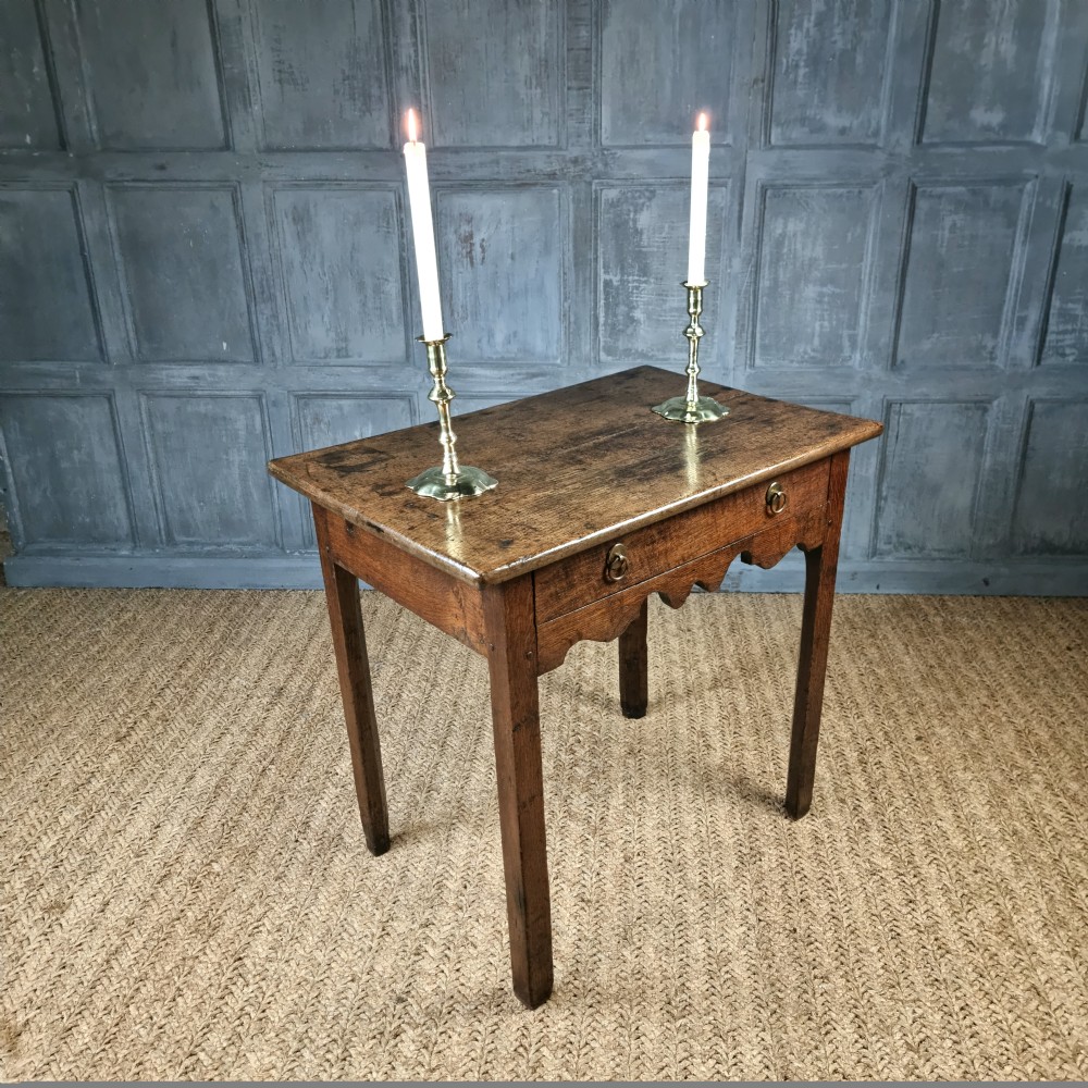 An 18th century oak side table. View IV