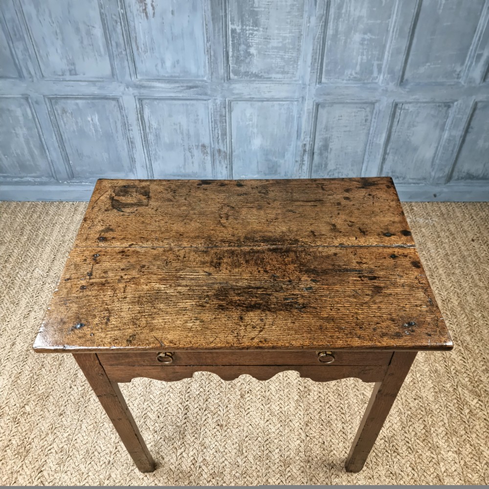 An 18th century oak side table. View V