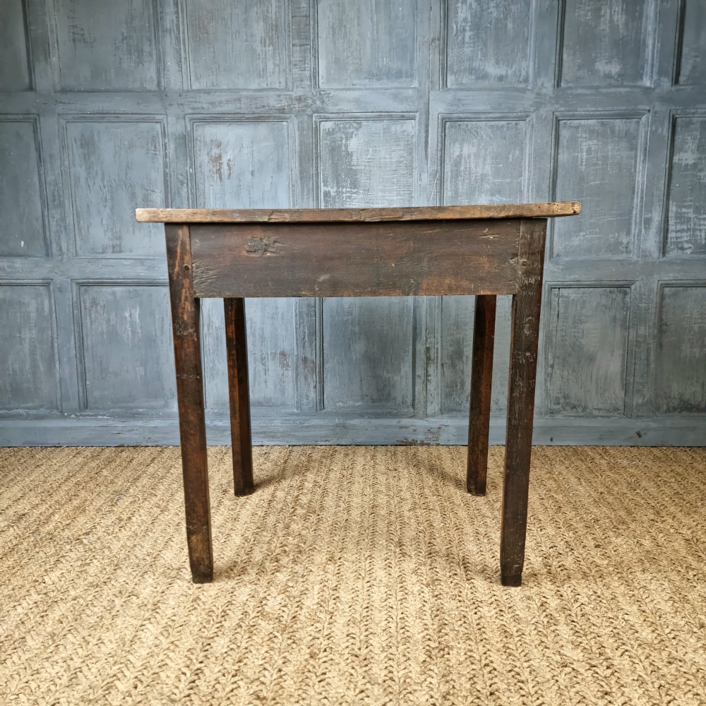 An 18th century oak side table. View VII