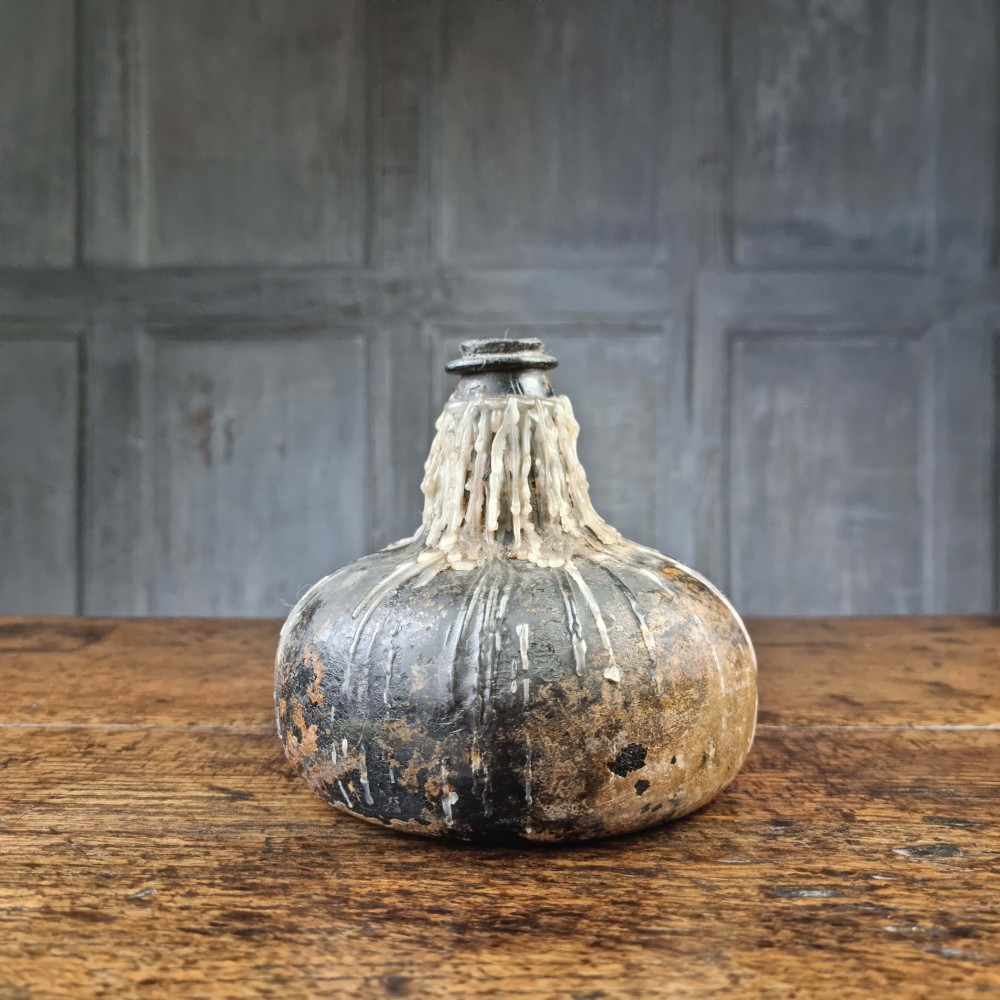 A late 17thC English onion bottle. 