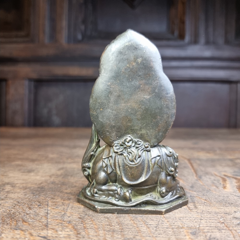 A small 19th century bronze figure of Guanyin. View VI
