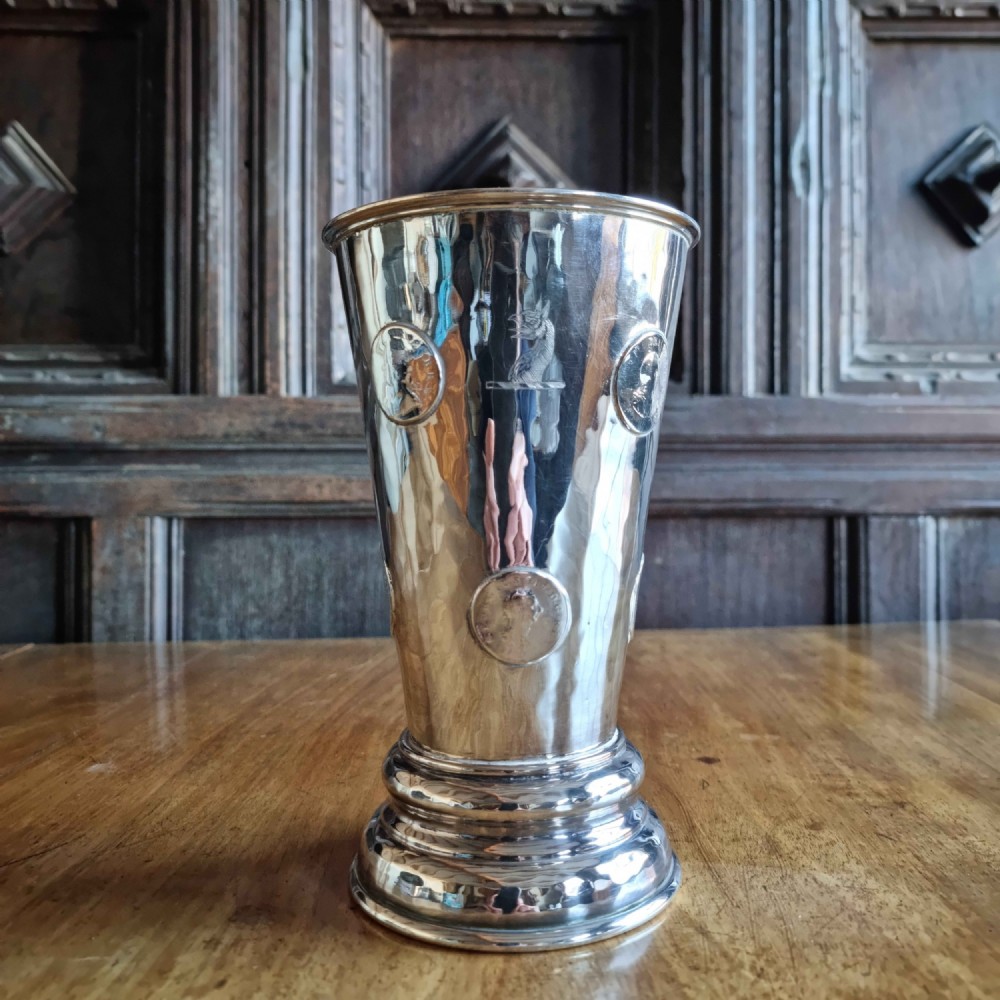 A George III silver plated gambling cup.