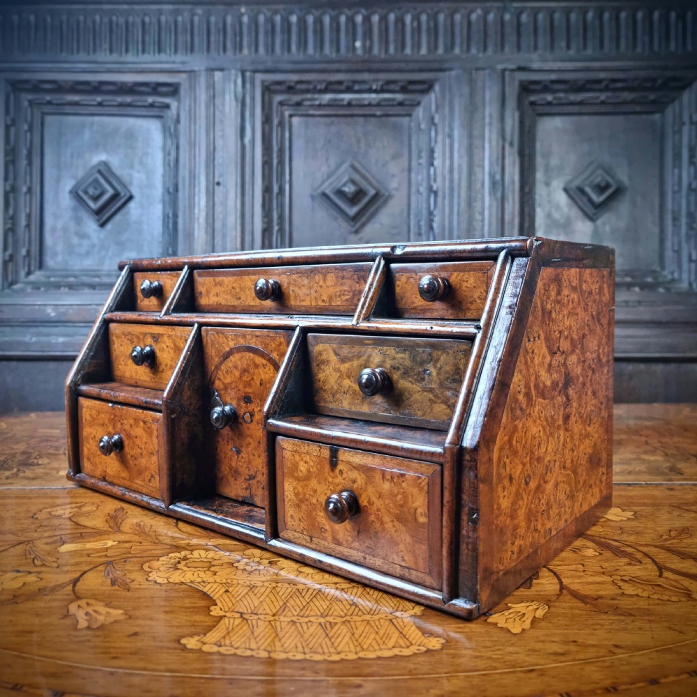 An early 18th century burr walnut jewelery chest. View IX