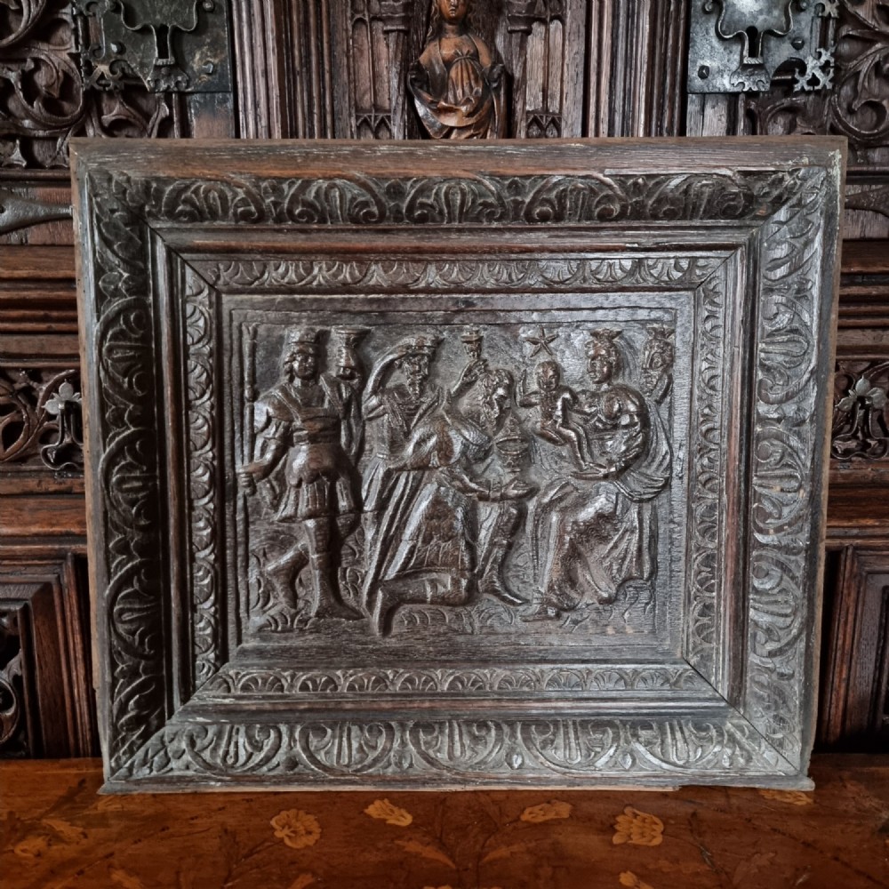A 17th century carved panel depicting the nativity. 