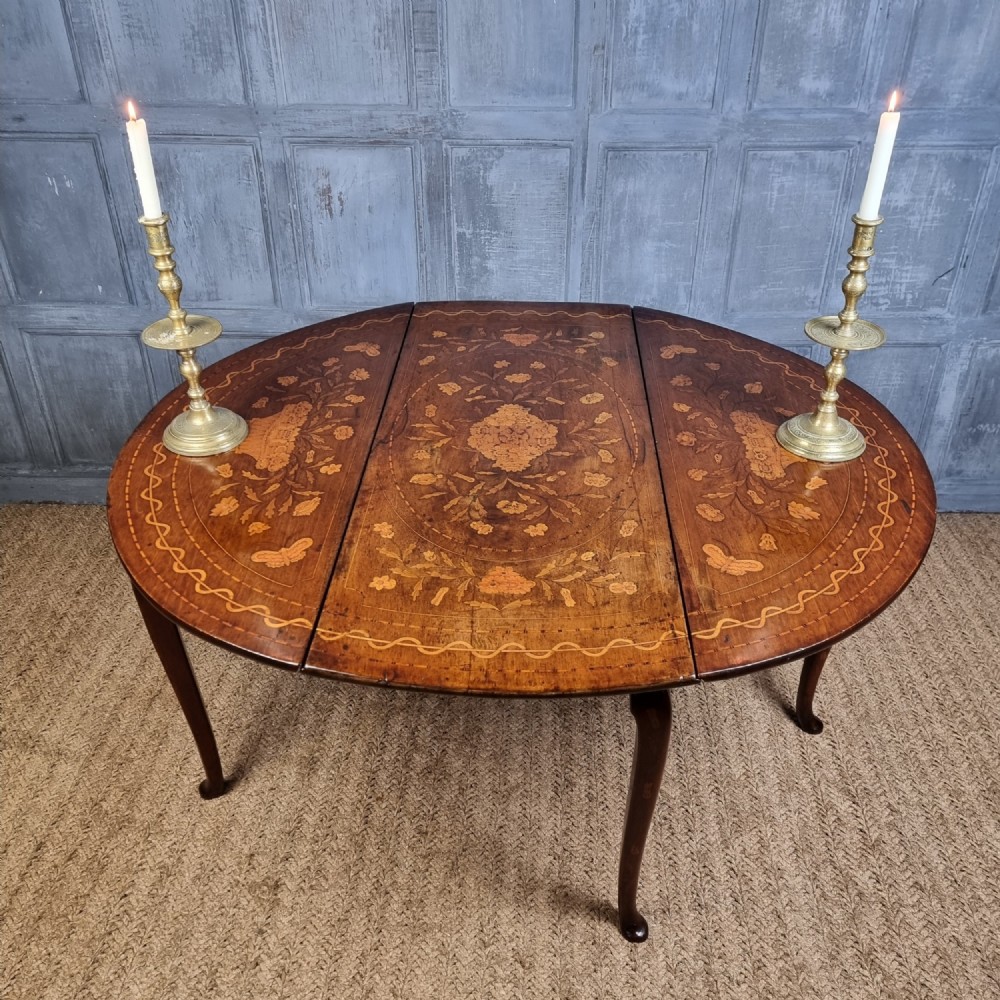 An 18th century marquetry table. 