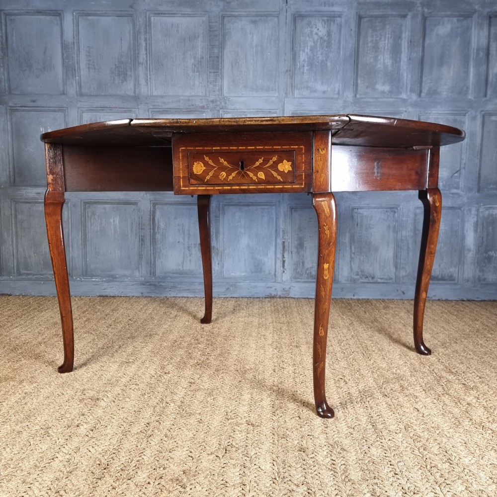 An 18th century marquetry table.  View XII