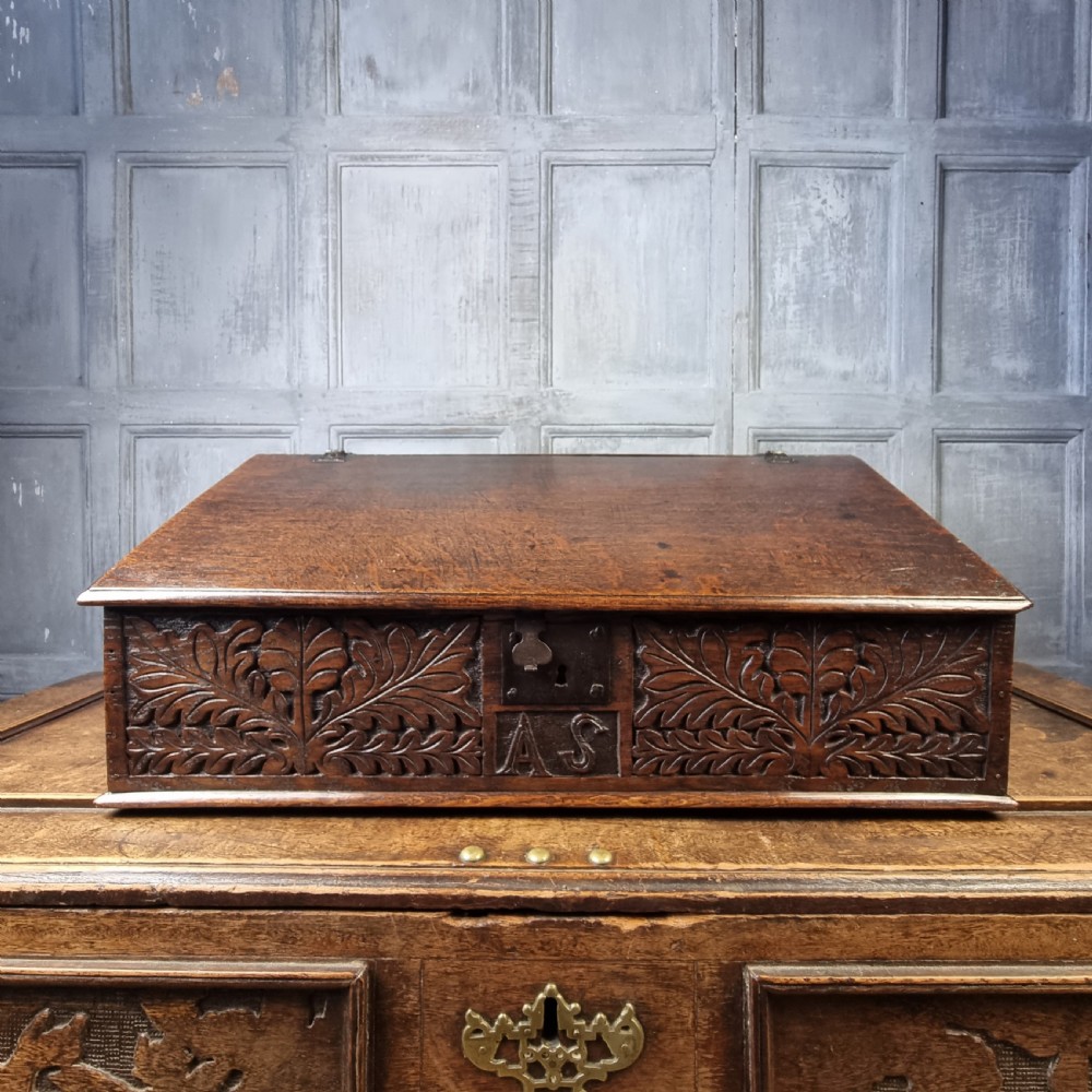 An early 18th century oak desk box. 