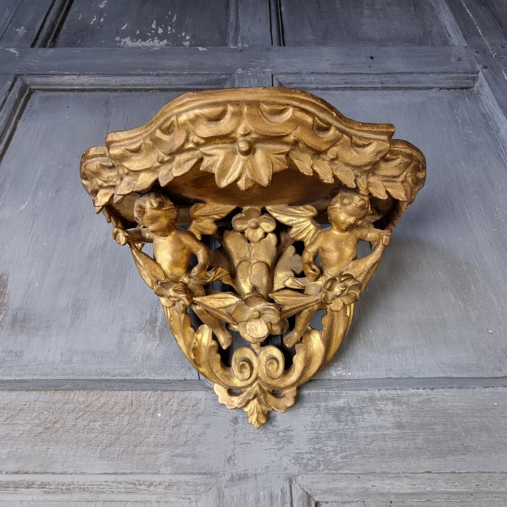 A small 18th century carved wall bracket. 