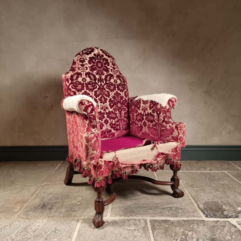 A william and mary style wing chair. 