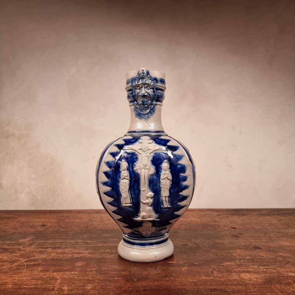 A religious 17th -18th century westerwald jug. 
