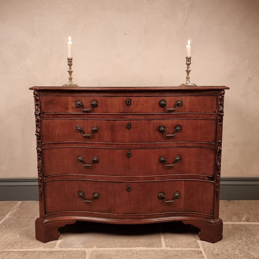 A superb 18th century serpentine chest of drawers.  View II