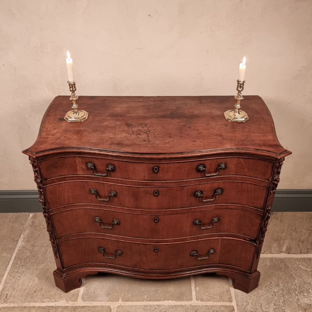 A superb 18th century serpentine chest of drawers.  View III