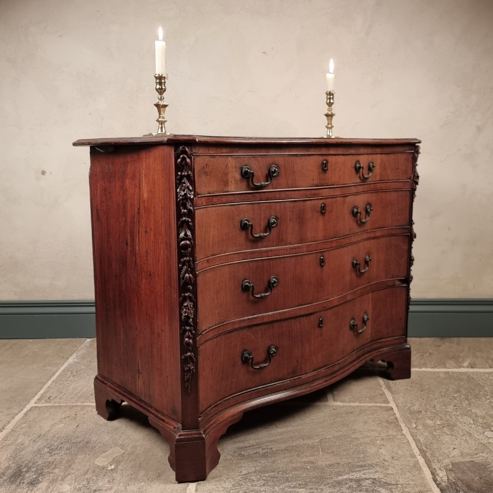 A superb 18th century serpentine chest of drawers. 
